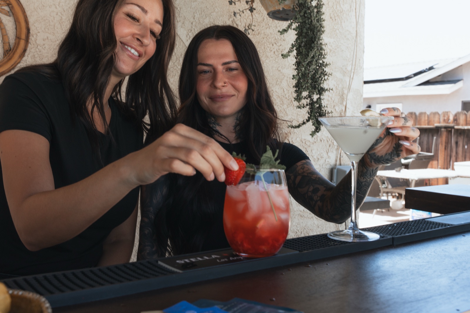 The B&J bartenders garnishing a strawberry-mint refresher